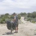 All packed up, I begin walking the bike down Keystone Canyon; my tripod blows over and my camera lands face-first and dies