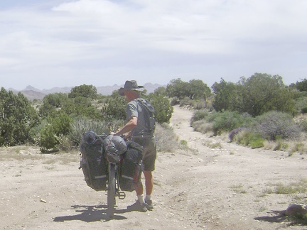 All packed up, I begin walking the bike down Keystone Canyon; my tripod blows over and my camera lands face-first and dies