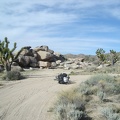 A half-mile down the dirt road, I select a campsite to left of the big rock pile here