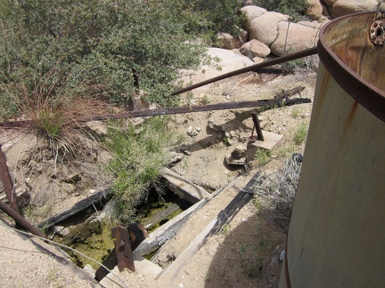 The old cistern at Howe Spring is dry, but there is some water in the adjacent hole in the ground