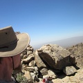 I take an energy bar (mmm, chocolate) break behind a boulder pile; it's really windy up here at 6015 feet elevation
