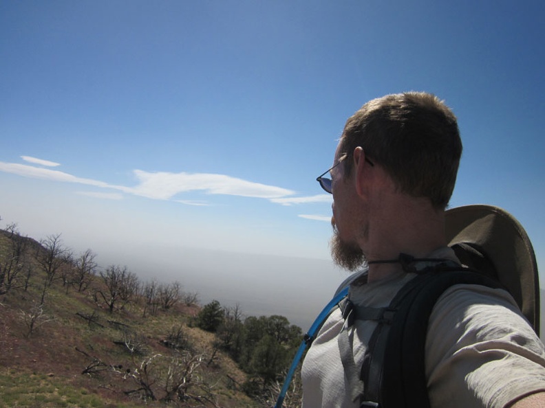 It's a clear sunny day above the smog layer that's blowing across the Ivanpah Valley below