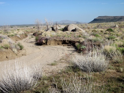 This part of Howe Spring Road follows a sandy, eroded wash