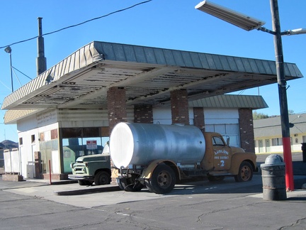 Between the Ludlow Café and the Ludlow Motel rests a former gas station, decorated with a couple of old vehicles