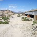 Lonely Nipton-Moore Road dips down to cross numerous drainage washes as it crosses the desert alongside the train tracks