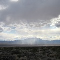 It looks like a few rainy patches are moving around out in the middle of Ivanpah Valley