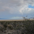 I keep looking back at the murky clouds over upper Ivanpah Valley toward Cima and the New York Mountains