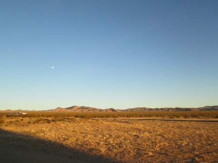 The nearly full moon is up already over the New York Mountains, waiting for the sun to go down