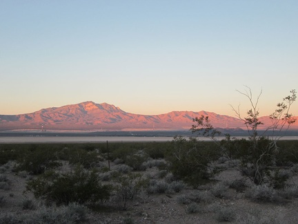 As the sun begins to rise, the Clark Mountain Range catches a nice pink light