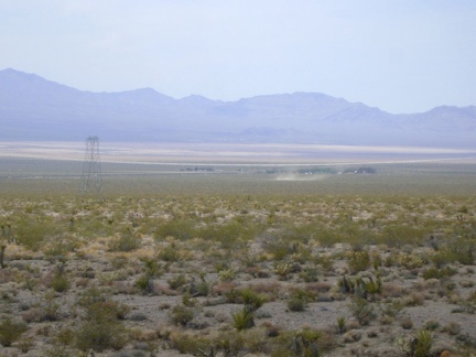 Looking down toward Nipton, I see a dust devil making its way across the fan