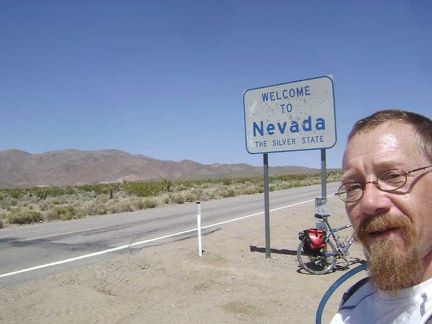 Three miles up the hill of Nipton Road, I reach the "Welcome to Nevada" sign that makes a perfect tourist photo