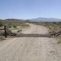 I ride another half mile beyond the Nevada State line and then turn south on this dirt road with a cattleguard