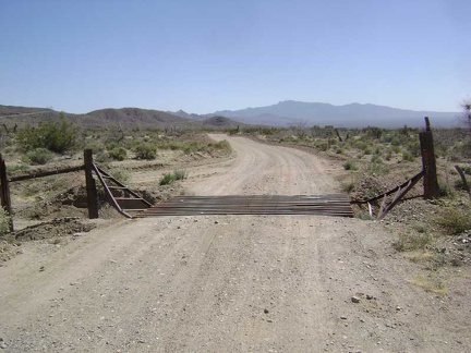 I ride another half mile beyond the Nevada State line and then turn south on this dirt road with a cattleguard