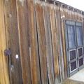 The heavily weathered board-and-batten exterior of the Cima store is in need of restoration work