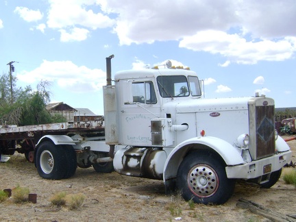 Faded paint on this old truck behind the Cima Store labels it as a possession of Providence Land and Cattle