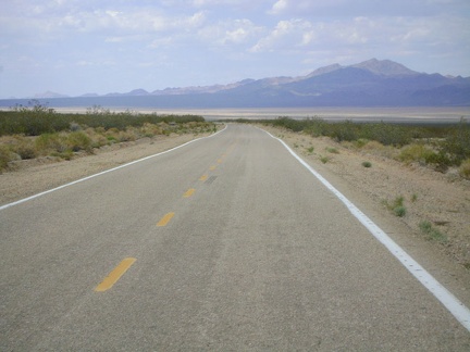 Still rolling quickly downward on Morning Star Mine Road, Ivanpah Valley comes clearer into view