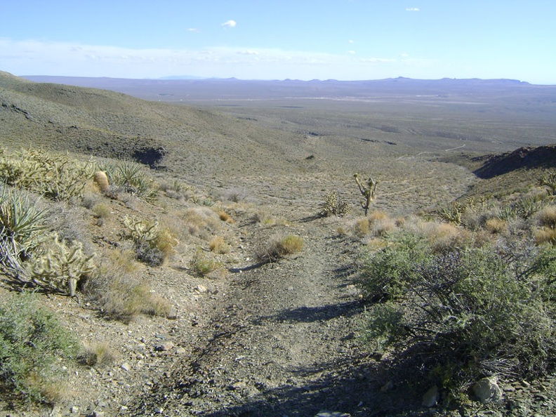 The old road crosses over the pass and I suddenly have big views down into Shadow Valley below