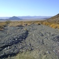 I decide to follow a U-shaped route from here down the wash and around the hills to get to the road leading up Idora Mine Canyon