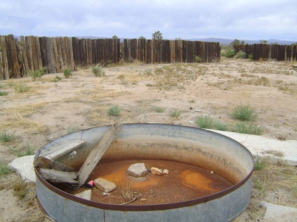 Well, the cistern in this old corral along Cima Road is dry, so I presume the big water tank nearby is empty too