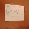 The Valley Wells urinal is so unique that an adjacent handwritten sign tells you that, "yes, this IS a urinal!"