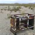 Nearby is the metal skeleton of an old counter or stove