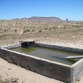 The old cistern here by Holliman Well off Black Canyon Road, with Pinto Mountain in the background, is full