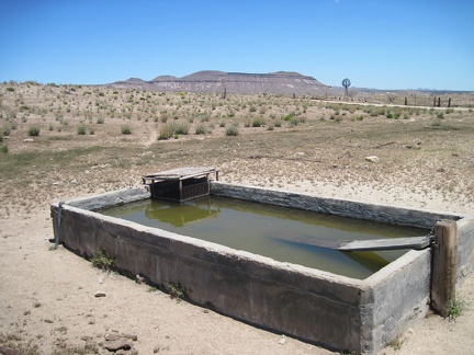 The old cistern here by Holliman Well off Black Canyon Road, with Pinto Mountain in the background, is full
