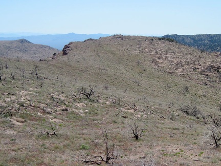 A glance  to the west shows how the slope up the back of Pinto Mountain ends abruptly at the steep escarpment