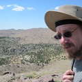 It's really windy up here on Pinto Mountain, so I often find myself holding my hat straps to help keep the hat on my head
