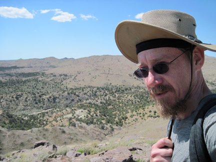 It's really windy up here on Pinto Mountain, so I often find myself holding my hat straps to help keep the hat on my head