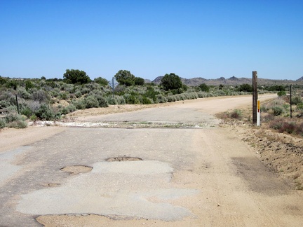Cedar Canyon Road east of the Mid Hills is mostly unpaved, except for this short stretch by a cattle guard