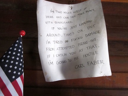 A warning note above the fireplace in the Bert Smith Rock House