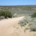 I leave the Bert Smith Rock House and coast down the hill into Watson Wash