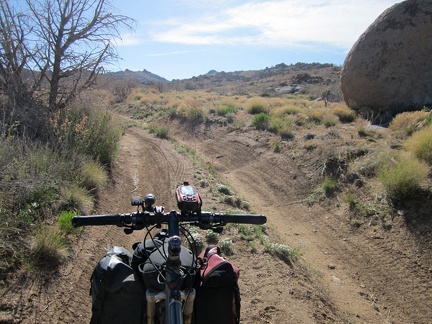 I pass a big boulder alongside the road to Bathtub Spring