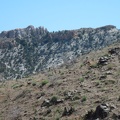 Once down in Beecher Canyon, I look up at distant rock formations in the Providence Mountains in the area around Summit Spring