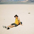 I sit down on The Racetrack playa, like I might do at any other beach