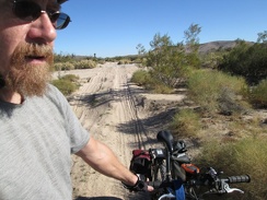 I have to walk the bike across several sandy wash crossings on the pipeline road