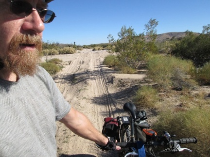 I have to walk the bike across several sandy wash crossings on the pipeline road