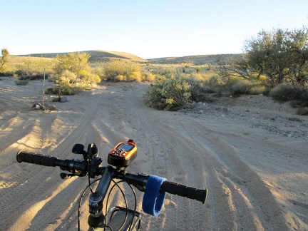 Predictably, I have to walk the bike across this sandy wash crossing on the way into the Hackberry Mountains