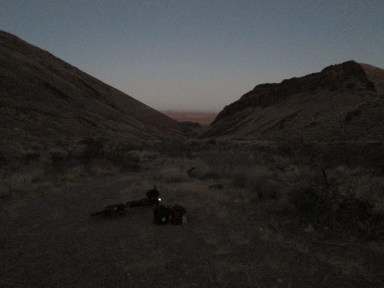I've just finished filtering my water and it's getting dark; time to ride back to camp at Piute Gorge, in those distant hills