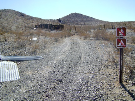 The only signs marking one's arrival at Rex Mine are these no-camping and no-campfires sign