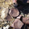 An old Copenhagen tobacco lid rusts quietly amongst other, less identifiable, cans at the old Rex Mine site
