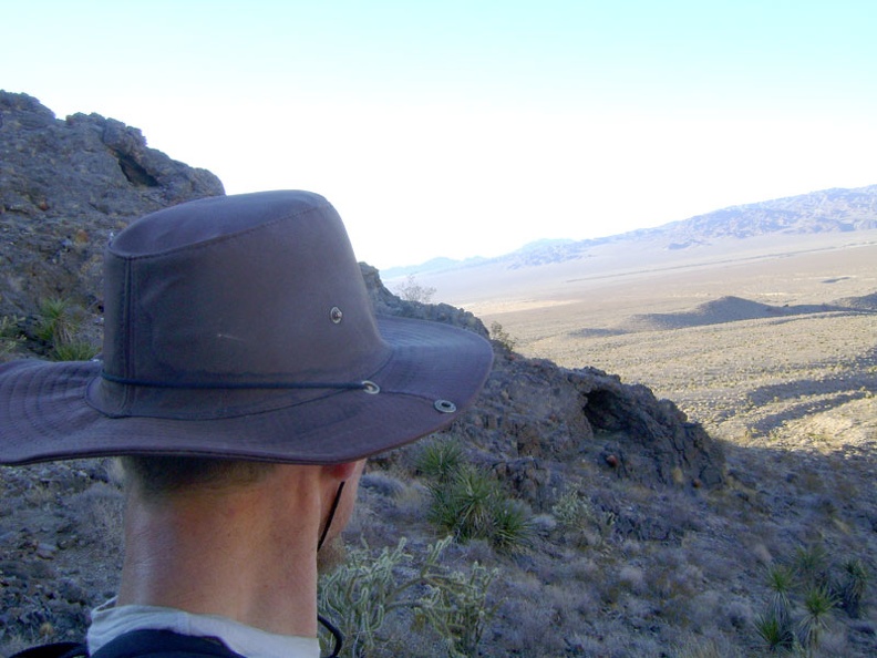 While pausing to plot a good route down the short steep hill, I notice a small cave in the hillside