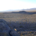 I linger for a few minutes on the rooster comb to take in the view over to Rex Mine, Kelso Dunes and far beyond