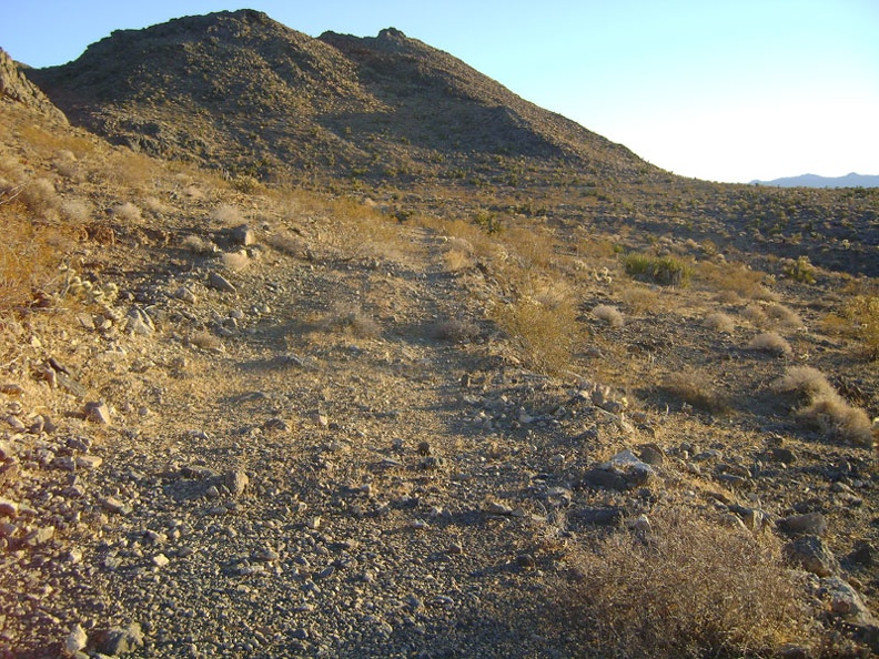 Back on the old road, it's time to head back to camp; the upper-left of the hill ahead is where I visited the cave a while ago