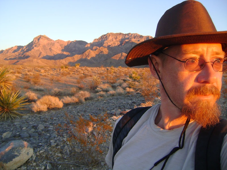 Catching the last hot-red rays of sunset as I walk down Rex Mine Road, with the Providence Mountains behind me