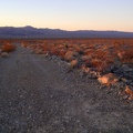 Heading down Rex Mine Road toward Kelso, a glimmer of red sunset light remains
