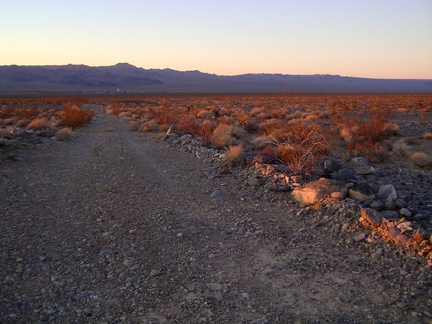 Heading down Rex Mine Road toward Kelso, a glimmer of red sunset light remains