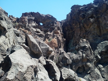 Oh, there's an eye, a tiny natural arch in the bubbly rock here near the top of the Rings Trail, Mojave National Preserve