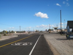 Route 66 reaches a stop sign as it passes through the little town of Daggett, California